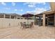 A brick-paved patio with seating, an umbrella, and access to a screened-in porch, enhancing outdoor enjoyment at 2240 Parrot Fish Dr, Holiday, FL 34691