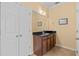 Bathroom featuring a granite vanity top and a linen closet at 2240 Parrot Fish Dr, Holiday, FL 34691