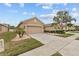Well-maintained home with a spacious driveway and landscaping, offering curb appeal and convenience at 2240 Parrot Fish Dr, Holiday, FL 34691
