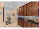 Hallway features dark wood cabinetry, mosaic backsplash, and modern lighting at 2240 Parrot Fish Dr, Holiday, FL 34691