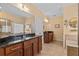 Elegant main bathroom with dual vanities, granite countertops, and separate shower and tub at 2240 Parrot Fish Dr, Holiday, FL 34691