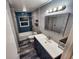 Renovated bathroom showcases a modern vanity, new fixtures, and updated shower at 2484 Roberta St, Largo, FL 33771