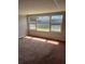 Bedroom features a large picture window with a view, neutral carpet, and plenty of natural light at 2484 Roberta St, Largo, FL 33771