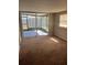 Bedroom featuring carpeting and sliding glass doors leading to a screened in patio at 2484 Roberta St, Largo, FL 33771