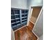 Hallway area features wood-look floors and a built-in bookshelf at 2484 Roberta St, Largo, FL 33771