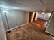The living room boasts carpet floors and an open doorway to another room at 2484 Roberta St, Largo, FL 33771