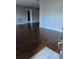 Bright living room featuring wood floors, light-colored walls, and a doorway to other rooms at 2484 Roberta St, Largo, FL 33771