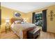 This bedroom has a bed, a window, and a decorative wall hanging at 2632 Enterprise E Rd # A23, Clearwater, FL 33759
