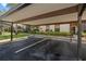 Designated covered carport parking with nicely landscaped grounds around the building at 2632 Enterprise E Rd # A23, Clearwater, FL 33759