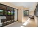 Bright lanai featuring tile flooring, large windows, and a built-in counter with cabinets at 2632 Enterprise E Rd # A23, Clearwater, FL 33759
