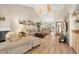 Open-concept living room featuring vaulted ceilings, wood flooring, and comfortable seating at 2632 Enterprise E Rd # A23, Clearwater, FL 33759