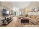 Bright and spacious living room with fireplace, neutral tones, wood flooring, and abundant natural light at 2632 Enterprise E Rd # A23, Clearwater, FL 33759