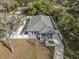 Aerial view of a single-story home featuring a well-maintained roof and fenced yard at 3405 Phillips St, Tampa, FL 33619