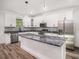 Modern kitchen boasts granite countertops and stainless steel appliances at 3405 Phillips St, Tampa, FL 33619