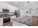 Open-concept kitchen offers granite counters and modern appliances at 3405 Phillips St, Tampa, FL 33619