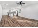 Open-concept space with a kitchen featuring white cabinetry at 3405 Phillips St, Tampa, FL 33619