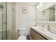Modern bathroom featuring a sleek vanity and a glass-enclosed shower, perfect for relaxation at 3462 Sutton Pl, Palm Harbor, FL 34684