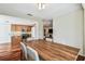Charming dining room with a wooden table located next to the kitchen and open living room area at 3462 Sutton Pl, Palm Harbor, FL 34684