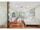 Spacious living room featuring sleek wood floors, recessed lighting, and open floor plan at 3462 Sutton Pl, Palm Harbor, FL 34684
