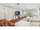 Bright living room featuring hardwood floors, recessed lighting, and neutral paint scheme throughout at 3462 Sutton Pl, Palm Harbor, FL 34684
