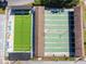 Top-down aerial view of recreational shuffleboard and game courts, ready for friendly competition at 3462 Sutton Pl, Palm Harbor, FL 34684