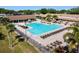 Stunning aerial view of a sparkling swimming pool and lounge area, perfect for relaxation and leisure at 3462 Sutton Pl, Palm Harbor, FL 34684