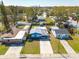 A beautiful aerial shot showing the home, its neighborhood, and the nearby city skyline at 358 51St N Ave, St Petersburg, FL 33703