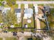 Aerial view of property shows backyard with firepit and shed, enclosed by a wooden fence for privacy at 358 51St N Ave, St Petersburg, FL 33703