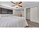 Bright bedroom featuring a ceiling fan, closet, plush carpet, and ample natural light at 358 51St N Ave, St Petersburg, FL 33703