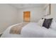 Cozy bedroom with plush carpet, a window with blinds, and a comfortable bed at 358 51St N Ave, St Petersburg, FL 33703