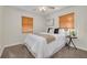 Cozy bedroom featuring a ceiling fan, a large window, and carpet at 358 51St N Ave, St Petersburg, FL 33703