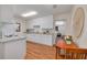 Bright kitchen featuring wood floors, white cabinets, granite countertops, and modern appliances at 358 51St N Ave, St Petersburg, FL 33703
