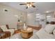 Comfortable living room open to kitchen, featuring hardwood floors and natural light at 358 51St N Ave, St Petersburg, FL 33703