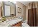 Bathroom featuring granite vanity with a large framed mirror and tiled shower at 36750 Us Highway 19 N # 19308, Palm Harbor, FL 34684