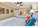 Charming bedroom featuring two beds, hardwood floors, and decorative accents at 36750 Us Highway 19 N # 19308, Palm Harbor, FL 34684