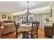 Cozy dining room featuring wood floors, a round table with chairs, and natural light at 36750 Us Highway 19 N # 19308, Palm Harbor, FL 34684