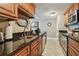 Well-maintained kitchen with granite countertops, wooden cabinetry, and stainless steel appliances at 36750 Us Highway 19 N # 19308, Palm Harbor, FL 34684