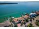 Beautiful waterfront home featuring a private dock, lush landscaping, and picturesque views from above at 4998 62Nd S Ave, St Petersburg, FL 33715