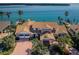 Expansive waterfront estate boasting a private dock, lush landscaping, and breathtaking views from above at 4998 62Nd S Ave, St Petersburg, FL 33715