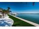 Waterfront backyard offers an artificial lawn, private dock, and a boat lift for nautical enthusiasts at 4998 62Nd S Ave, St Petersburg, FL 33715