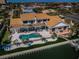 Gorgeous backyard with a refreshing pool, lounge chairs, and private dock overlooking the water at 4998 62Nd S Ave, St Petersburg, FL 33715