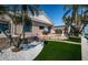 Beautiful backyard features an outdoor patio, lush lawn, and mature landscaping at 4998 62Nd S Ave, St Petersburg, FL 33715