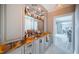 A stylish bar area featuring custom cabinetry, granite countertops, and ample storage creates an ideal space for entertaining at 4998 62Nd S Ave, St Petersburg, FL 33715