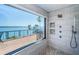 Bright shower with bay views, light colored tile and rain shower head at 4998 62Nd S Ave, St Petersburg, FL 33715