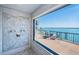Large picture window with bay views inside the shower with stone tile floor and shower at 4998 62Nd S Ave, St Petersburg, FL 33715