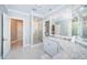 This bathroom features a glass walk-in shower, stone countertop, and vanity with a decorative mirror at 4998 62Nd S Ave, St Petersburg, FL 33715