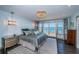 This bedroom features waterfront views, ample natural light, and a modern design at 4998 62Nd S Ave, St Petersburg, FL 33715
