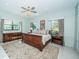 Tranquil bedroom with ample natural light, custom cabinets and plush carpet at 4998 62Nd S Ave, St Petersburg, FL 33715
