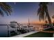 Exterior of boat dock showing boat lift along calm waterfront at sunset at 4998 62Nd S Ave, St Petersburg, FL 33715