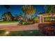 Circular paver driveway leading to a well-manicured home with lush tropical landscaping at 4998 62Nd S Ave, St Petersburg, FL 33715